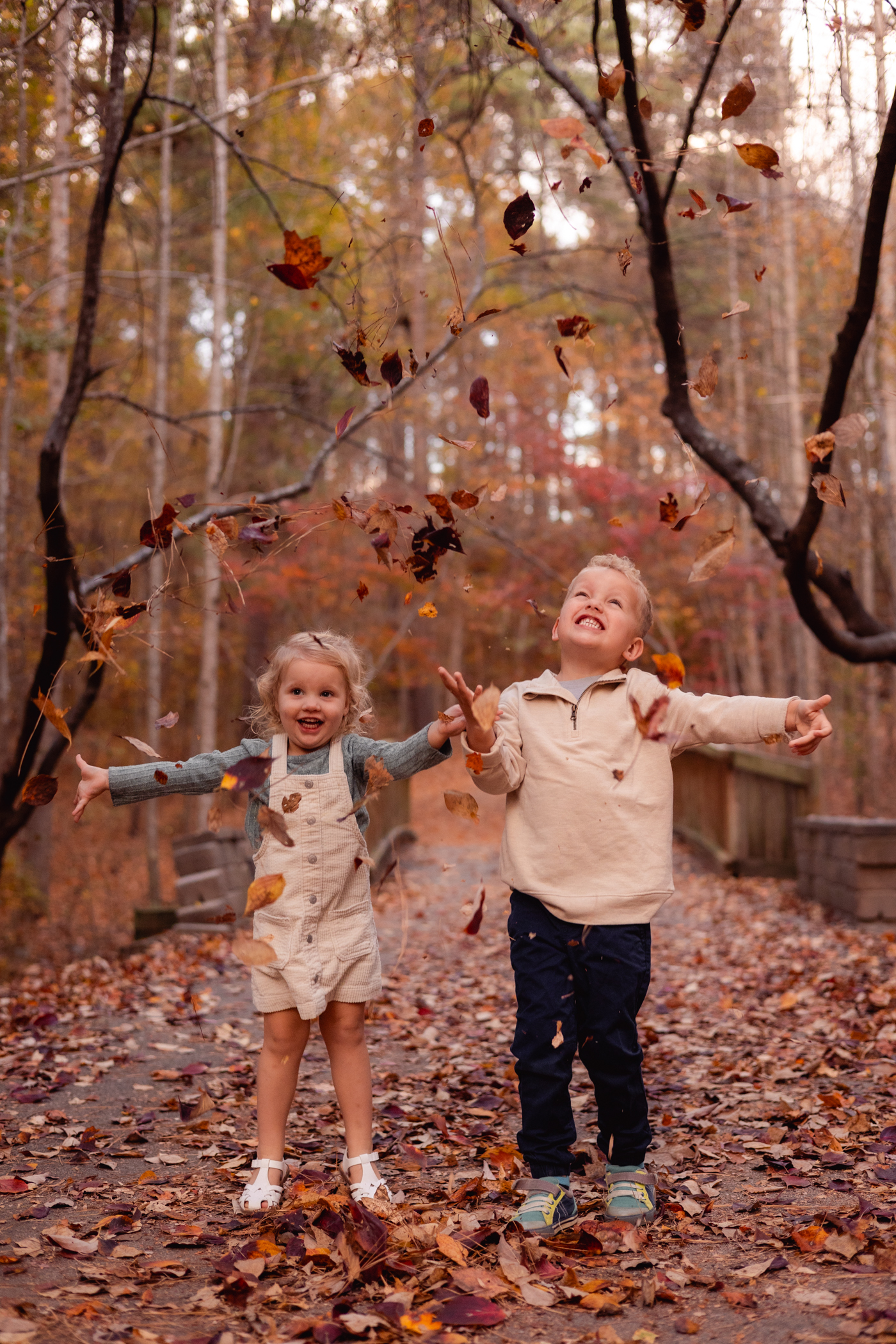 Kids playing in leaves